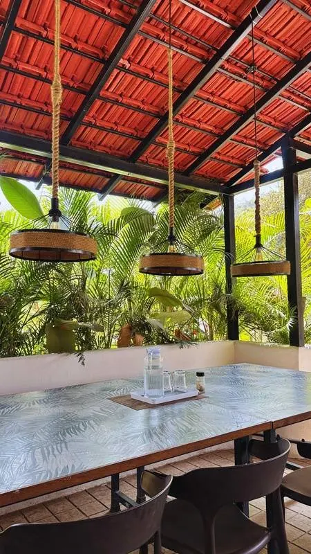 Open-air restaurant with handwoven pendant lamps