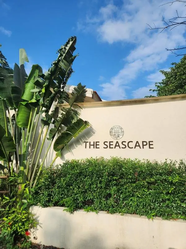 The Seascape entrance amid tropical greenery
